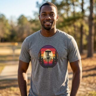Disc Golf Sunset Graphic Tee — Art Outbreak Origin t-shirt front view with graphic design and typography