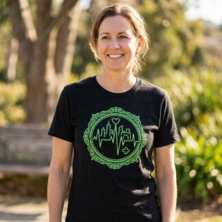 City skyline silhouette with medical heartbeat pulse line across the urban landscape on nurse graphic tee